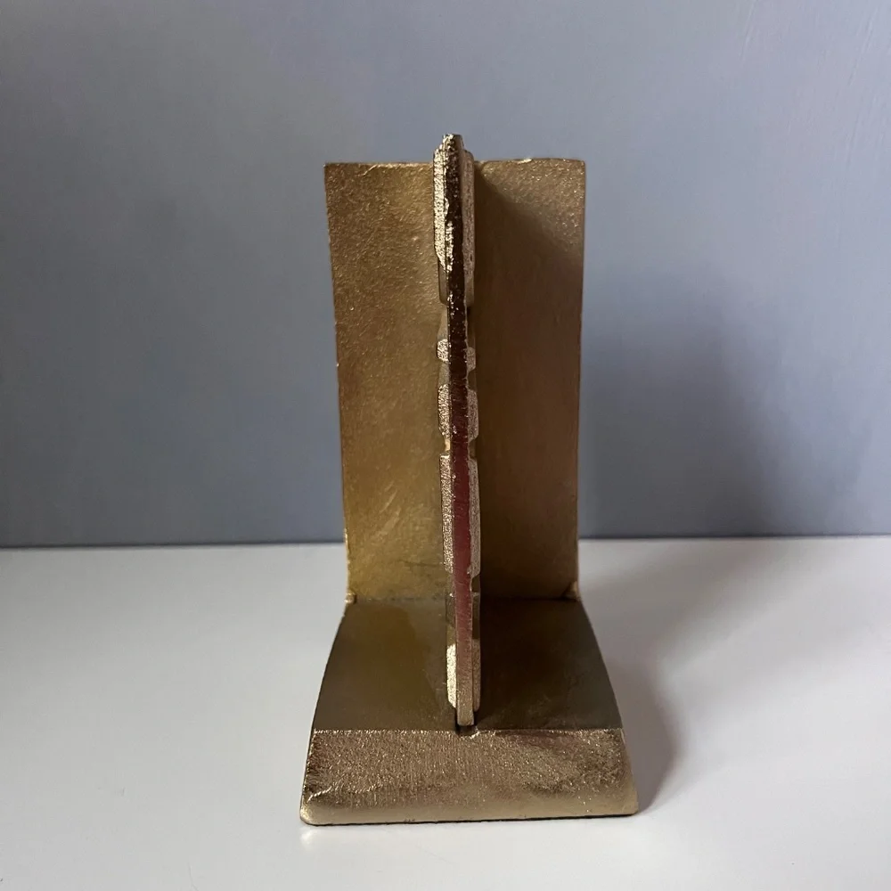 West Elm sculptural bookend in textured antique gold finish.